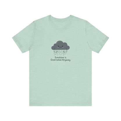 Pale blue t-shirt with a cartoon cloud crying and the text "Sunshine is Overrated Anyway."