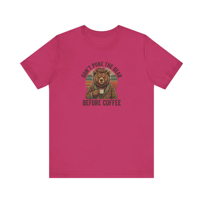 Bear in robe holding coffee mug, text "Don't poke the bear before coffee."