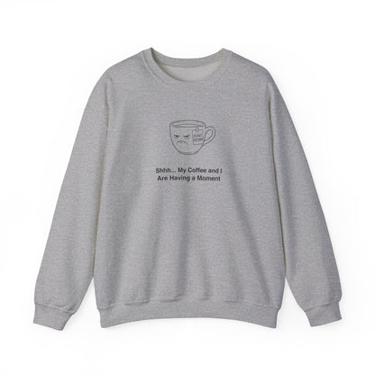Grey sweatshirt with a grumpy coffee cup design and text: Shhh... My Coffee and I Are Having a Moment.