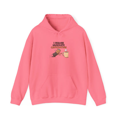 Pink hoodie with cartoon cat jumping for a coffee cup, text "I require immediate caffeination".