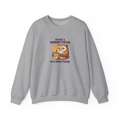 Grey sweatshirt with an owl holding a coffee cup and text.