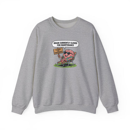Gray sweatshirt with cartoon brain wearing sunglasses relaxing on a lounge chair.
