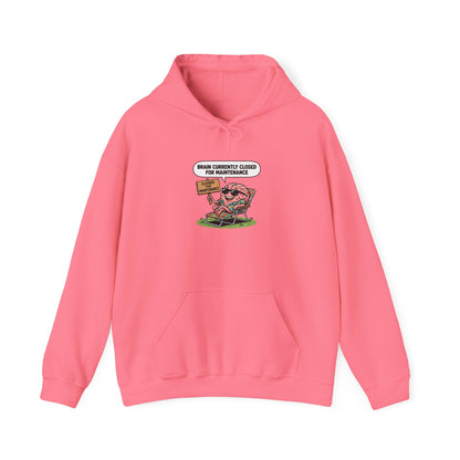 Pink hoodie with cartoon brain wearing sunglasses relaxing with "Brain Closed for Maintenance" sign.