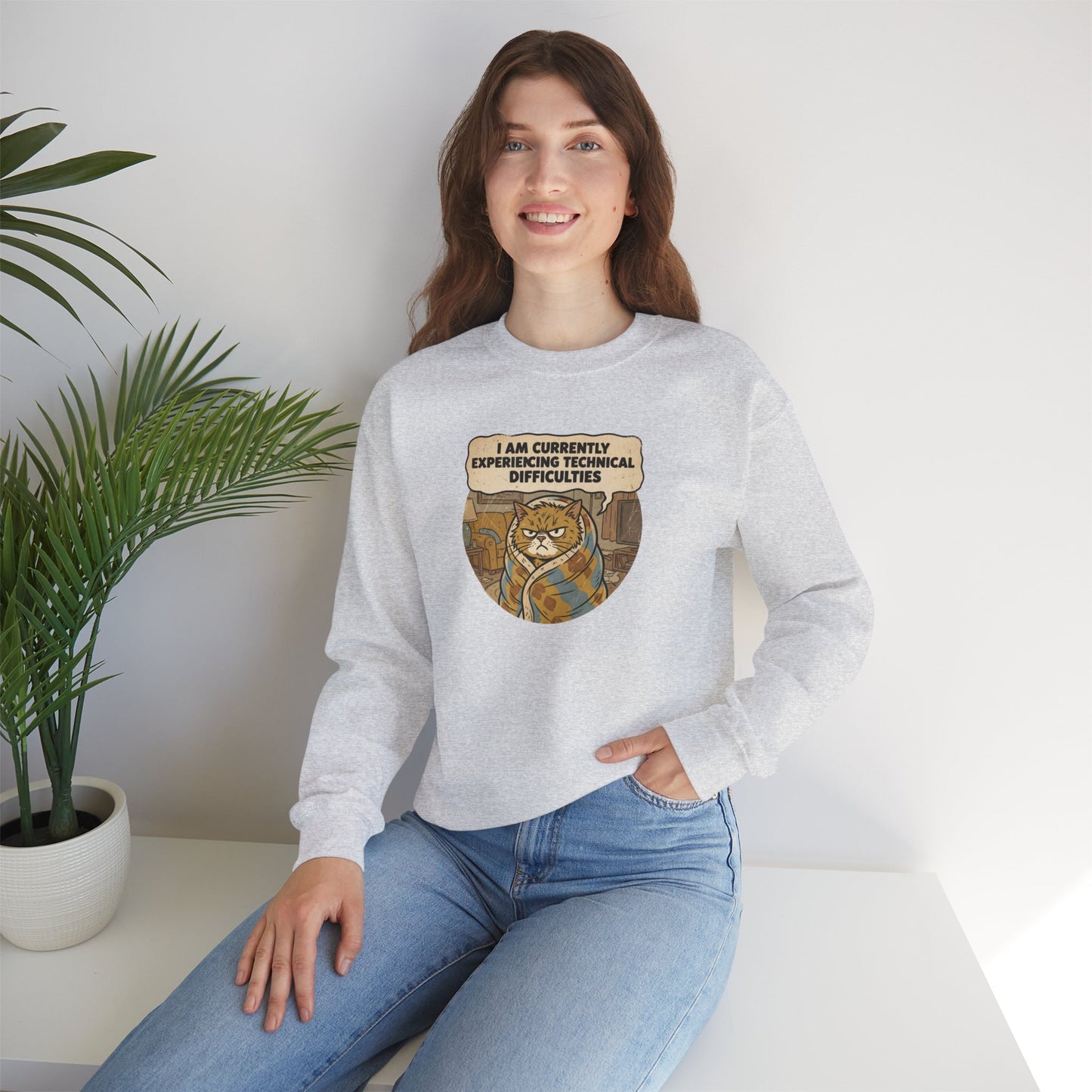 Gray sweatshirt with a cat graphic saying "I am currently experiencing technical difficulties."