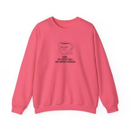 Pink sweatshirt with a coffee mug graphic saying "SHHH, MY COFFEE AND I ARE HAVING A MOMENT".