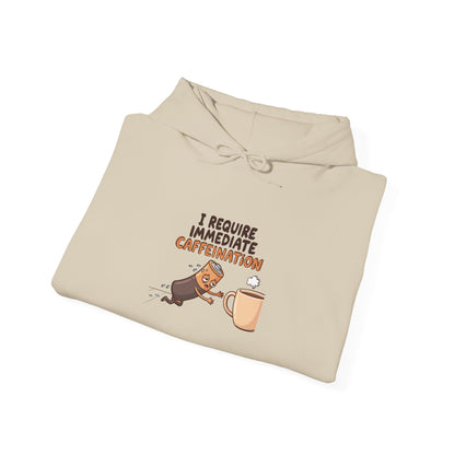 Beige hoodie with cartoon battery running towards a coffee cup with text "I require immediate caffeination."
