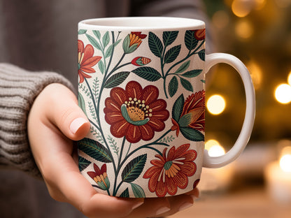 Hand Holding Mug with Vibrant Floral Design Mug Product