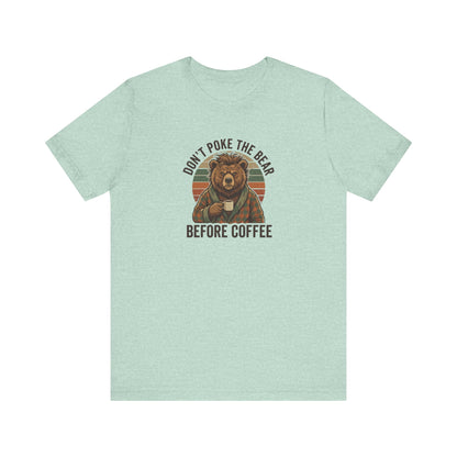Bear wearing plaid robe holding coffee mug with text "Don't poke the bear before coffee".