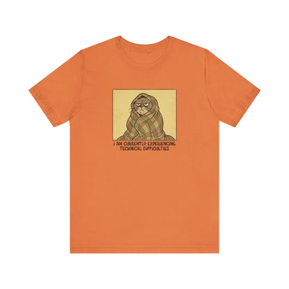 Orange t-shirt with a cat wrapped in a blanket saying "I am currently experiencing technical difficulties."