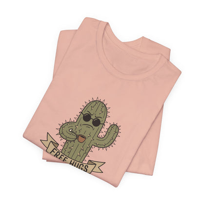 T-shirt with a cartoon cactus wearing sunglasses, holding a coffee mug, with "FREE HUGS" banner.