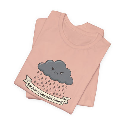 Pink t-shirt with a sad cloud and text that reads "Sunshine is Overrated Anyway".