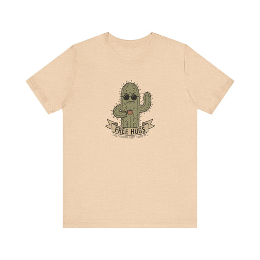 T-shirt graphic of a cactus wearing sunglasses and holding a sign that says "FREE HUGS".