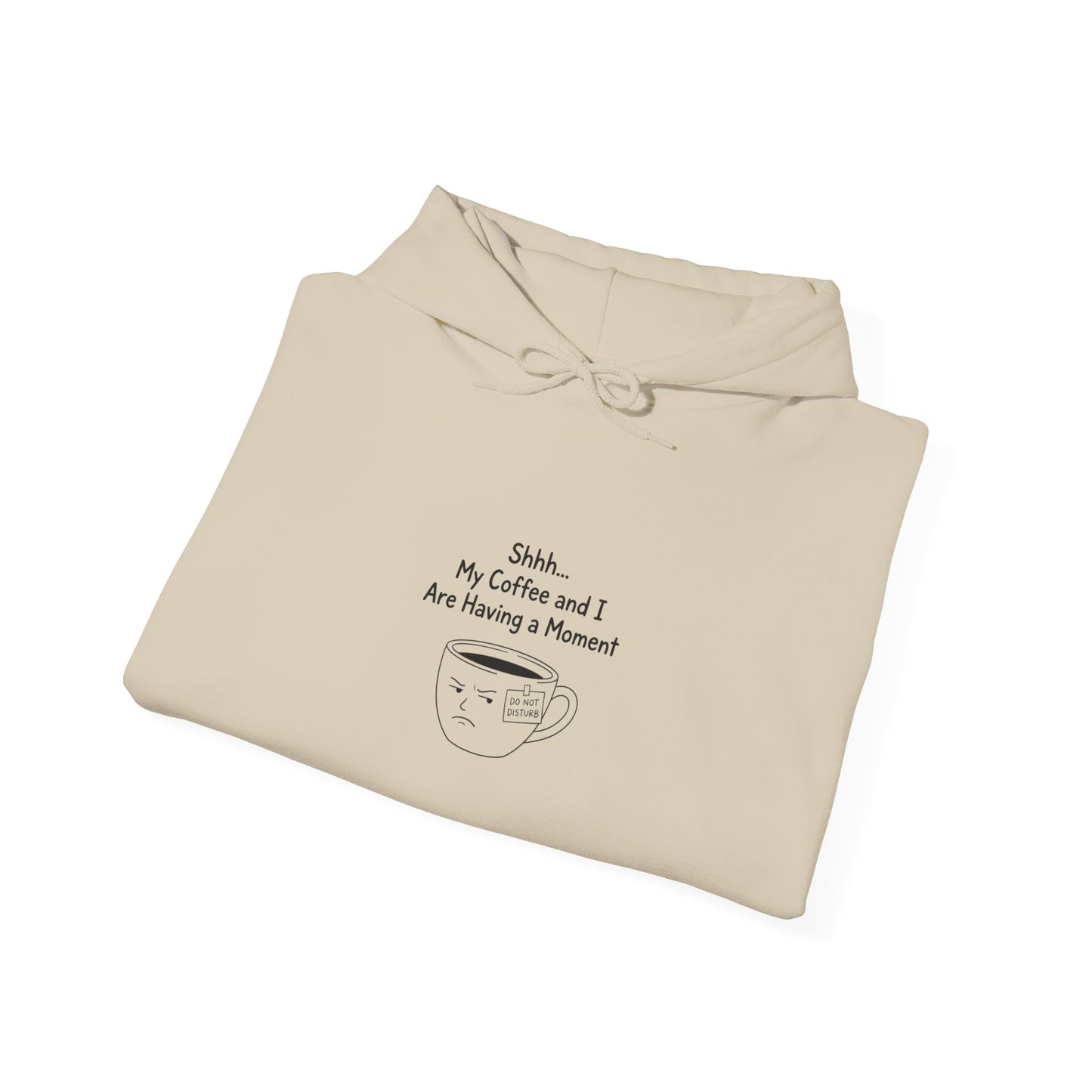 Cream hoodie with "Shhh... My Coffee and I Are Having a Moment" and frowning coffee cup design.
