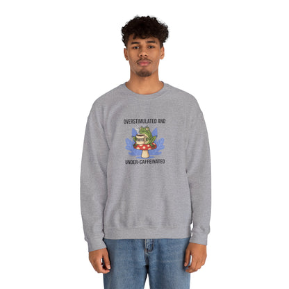 Gray sweatshirt with frog on mushroom, "Overstimulated and Under-Caffeinated" text.