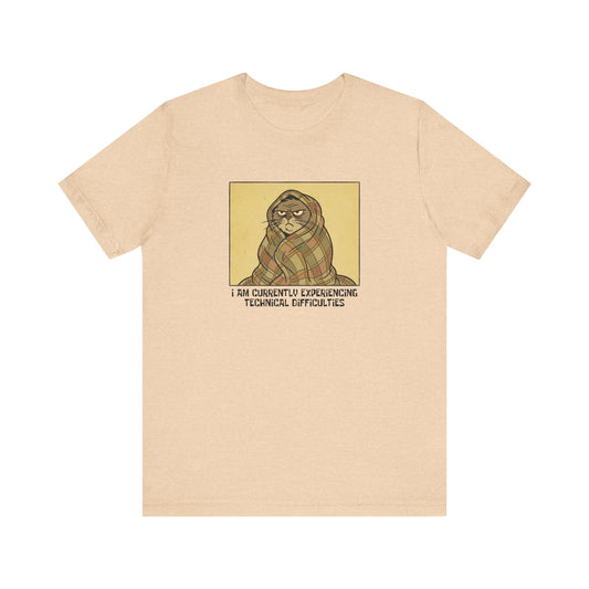 T-shirt with cartoon cat wrapped in blanket, text reads "I AM CURRENTLY EXPERIENCING TECHNICAL DIFFICULTIES".