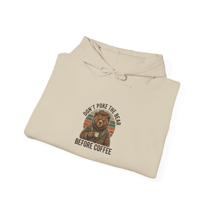 Beige hoodie with "Don't poke the bear before coffee" text and a bear drinking coffee.