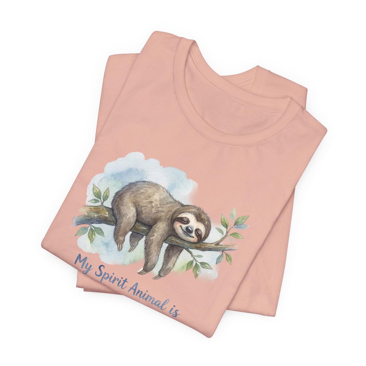 Peach t-shirt with watercolor sloth on a branch and text "My Spirit Animal is".