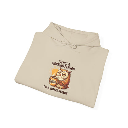 Cream hoodie with owl graphic and "I'm Not a Morning Person" text.