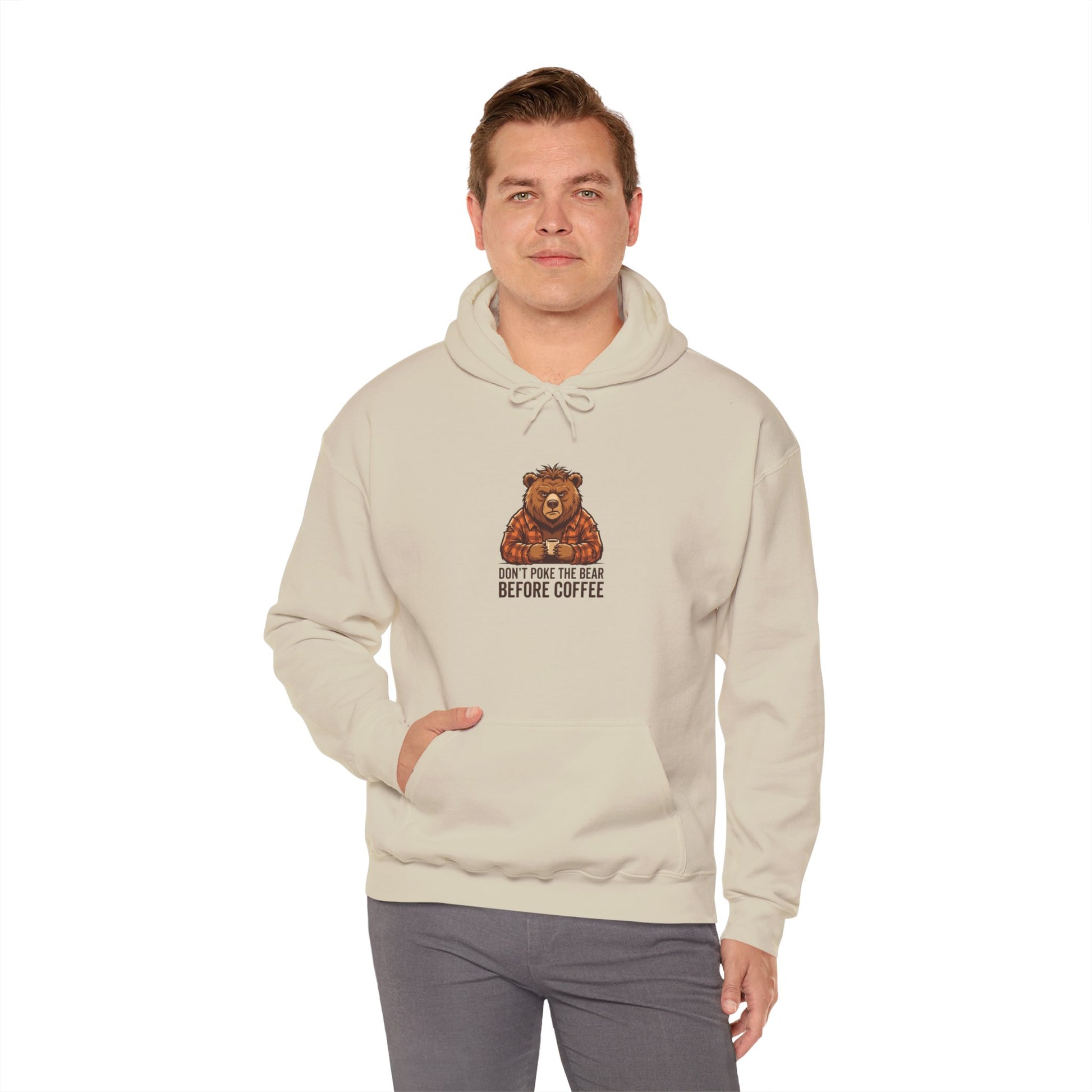 Cream hoodie with a cartoon bear drinking coffee and text.
