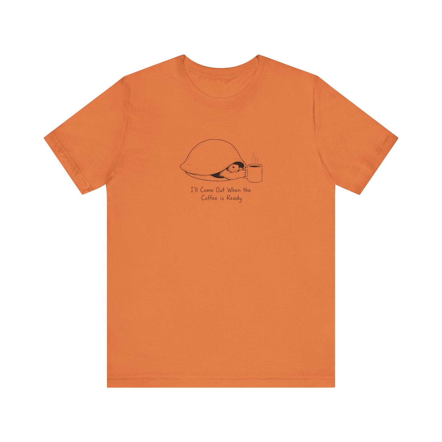 Orange t-shirt with a turtle and coffee cup graphic and text.