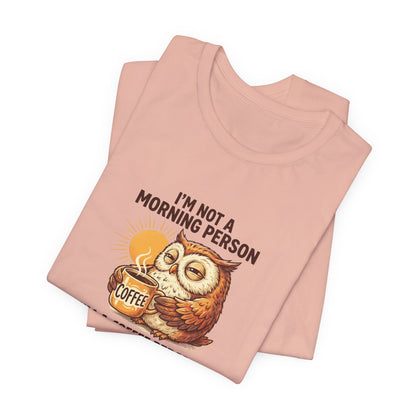 Peach t-shirt with owl holding coffee and "I'm not a morning person" text.