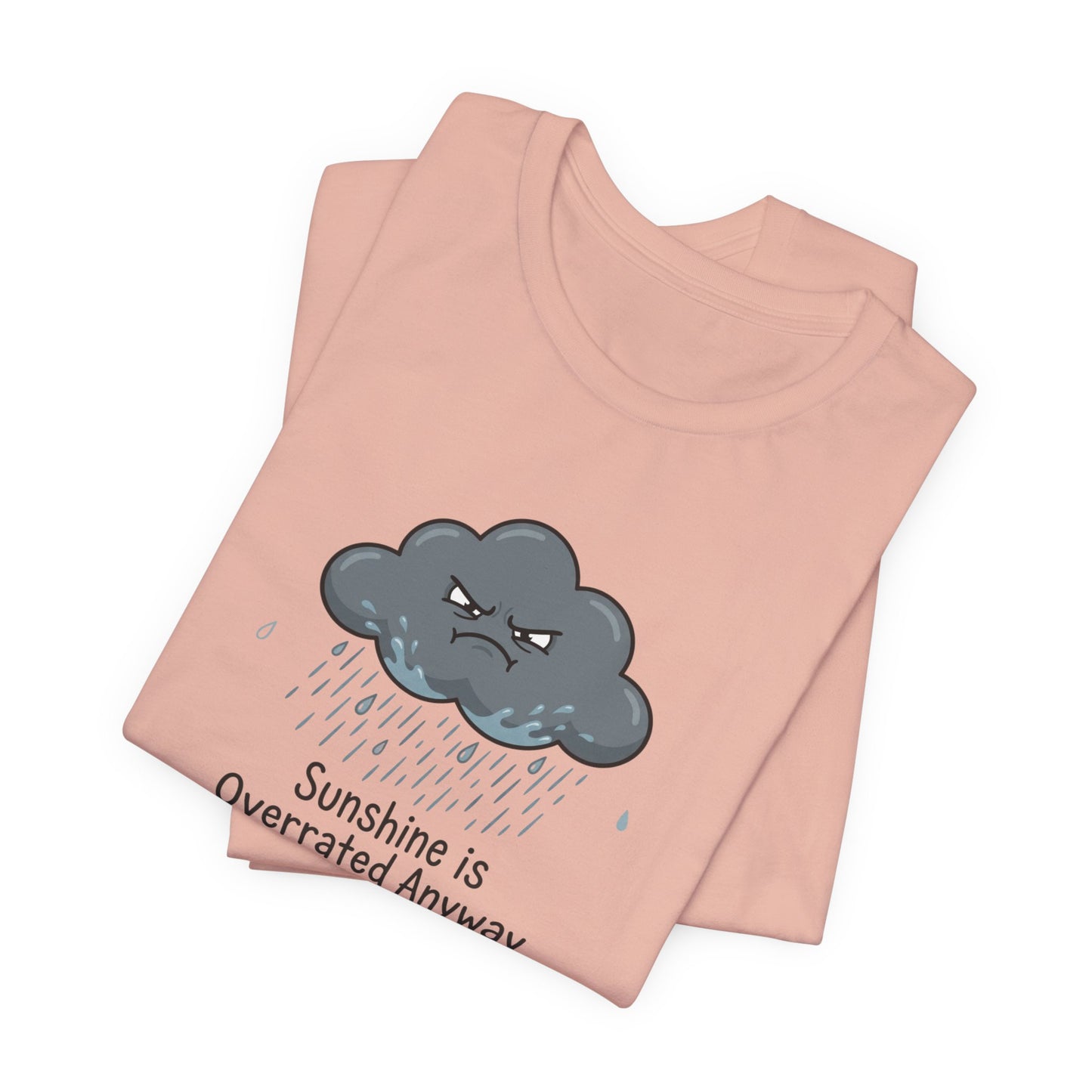Pink t-shirt with a grumpy cloud and rain graphic, text reads "Sunshine is Overrated Anyway".