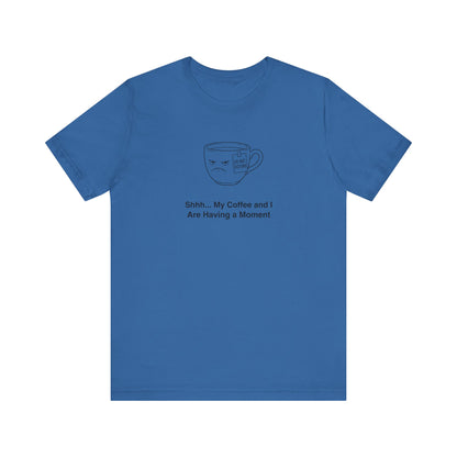 Blue t-shirt with a sad coffee cup illustration and text "Shhh... My Coffee and I Are Having a Moment".
