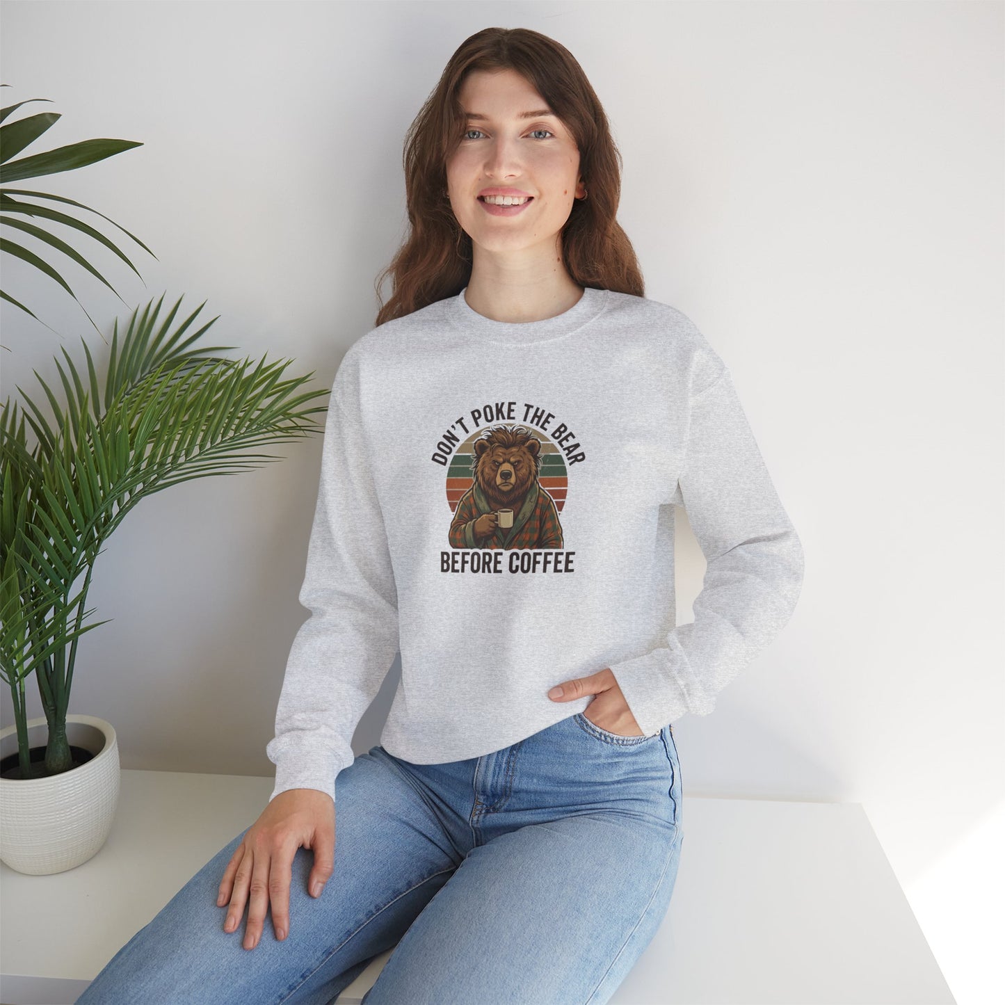 Gray sweatshirt with "Don't Poke the Bear Before Coffee" text and bear graphic.
