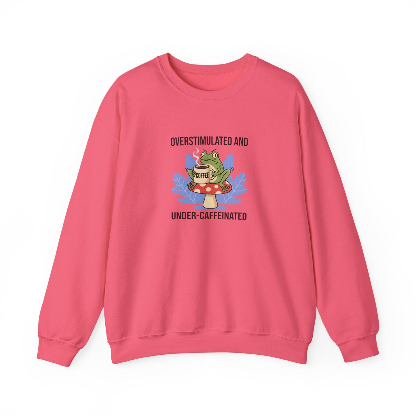 Pink crewneck sweatshirt with frog and "Overstimulated and Under-Caffeinated" text.
