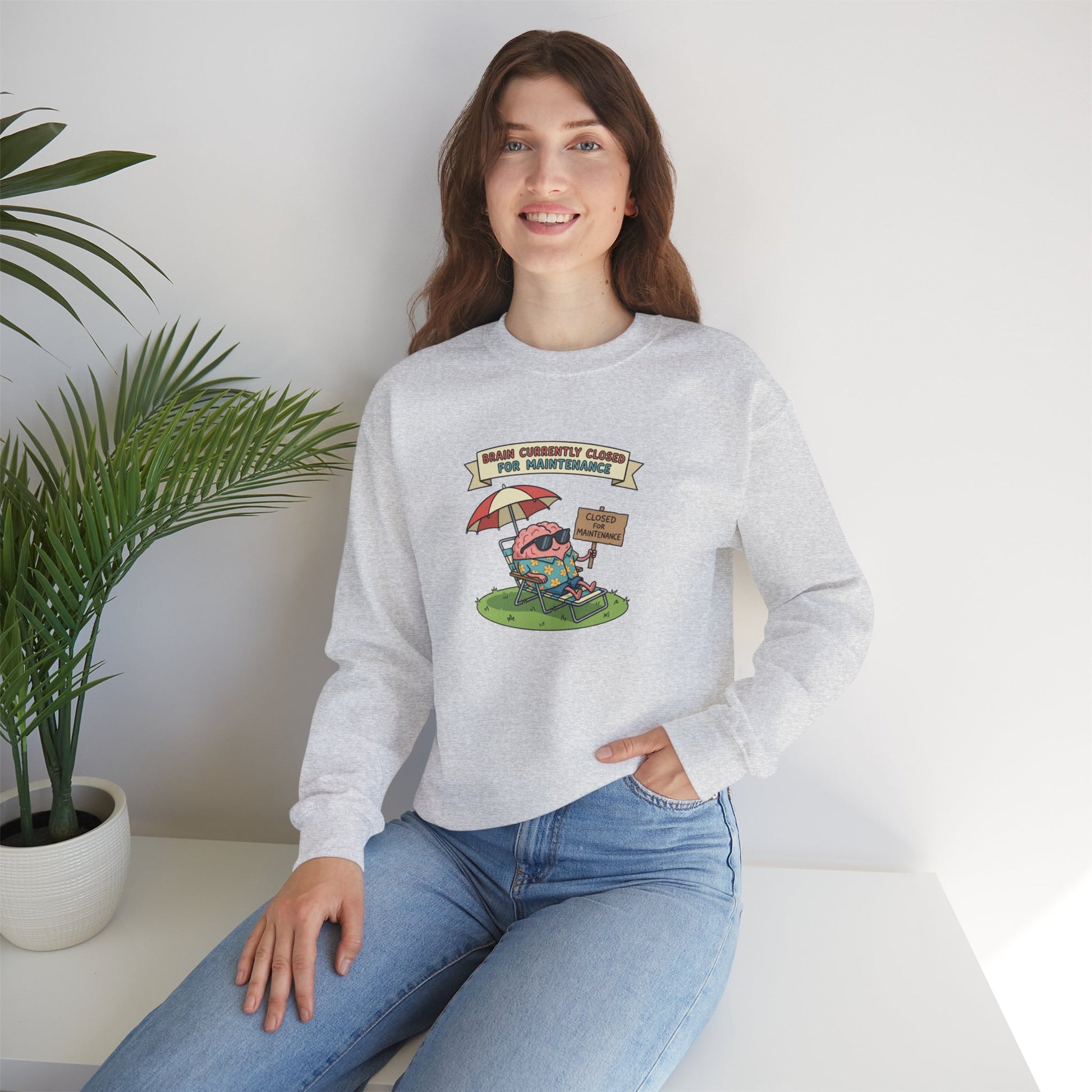 Light gray sweatshirt with cartoon brain on a beach chair, text "BRAIN CURRENTLY CLOSED FOR MAINTENANCE".