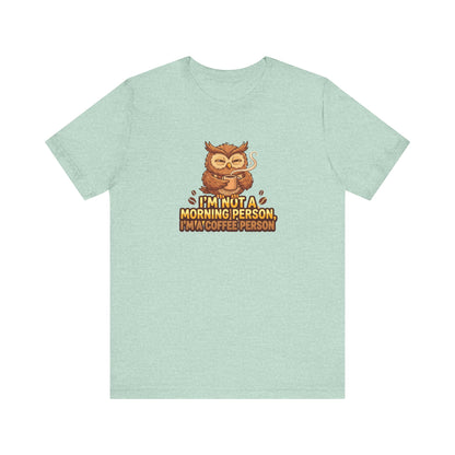 Illustration of an owl with coffee cup, text reads "I'm not a morning person, I'm a coffee person."