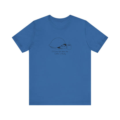 Blue t-shirt with a cartoon turtle peeking out of a shell with coffee cup.