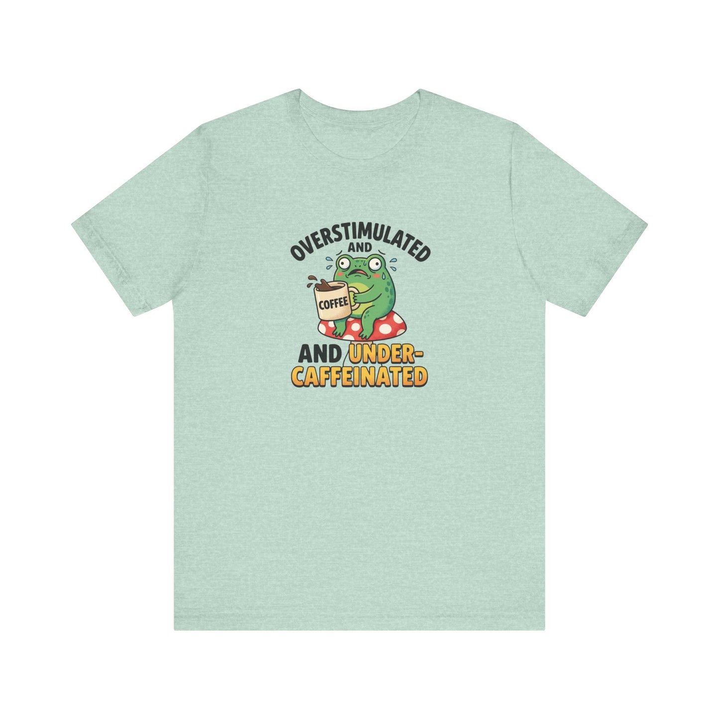 Green t-shirt with a cartoon frog holding a coffee cup, feeling overstimulated and caffeinated.