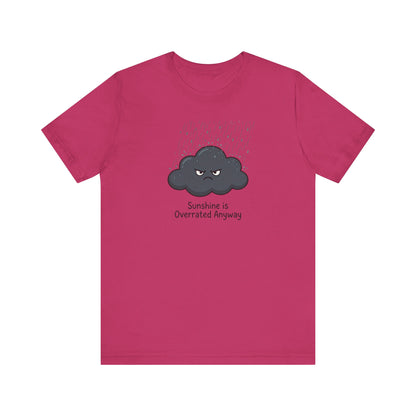 Pink t-shirt with a grumpy cloud graphic and "Sunshine Is Overrated Anyway" text.