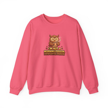 Pink sweatshirt with cartoon owl holding coffee mug and text.