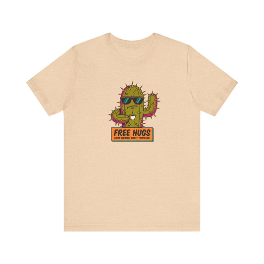 T-shirt with cartoon cactus wearing sunglasses, saying "FREE HUGS" and "JUST KIDDING, DON'T TOUCH ME!".