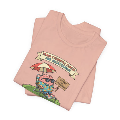 Pink t-shirt with cartoon brain wearing sunglasses relaxing on a beach chair, text reads "Brain Currently Closed For Maintenance".