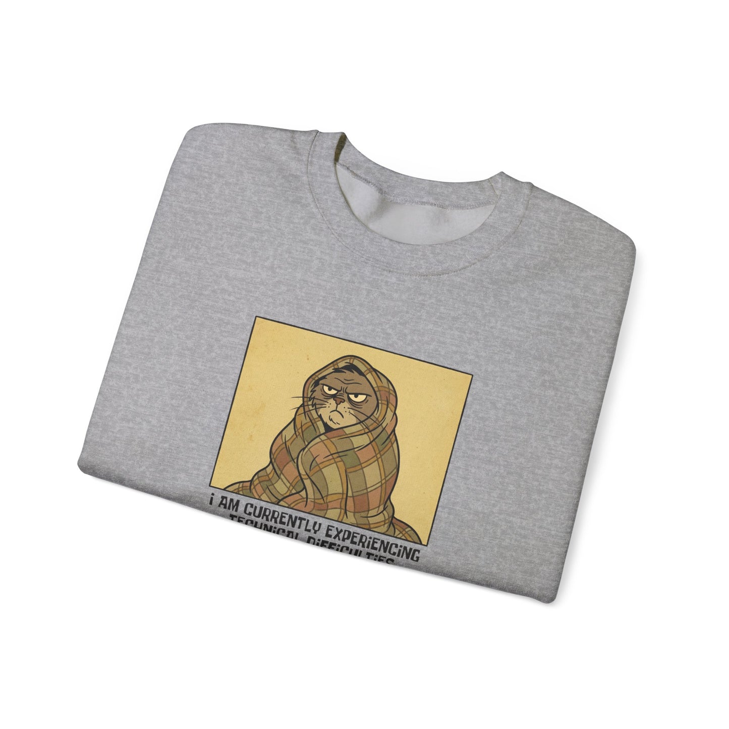 Gray sweatshirt with a grumpy cat graphic on a plaid blanket.