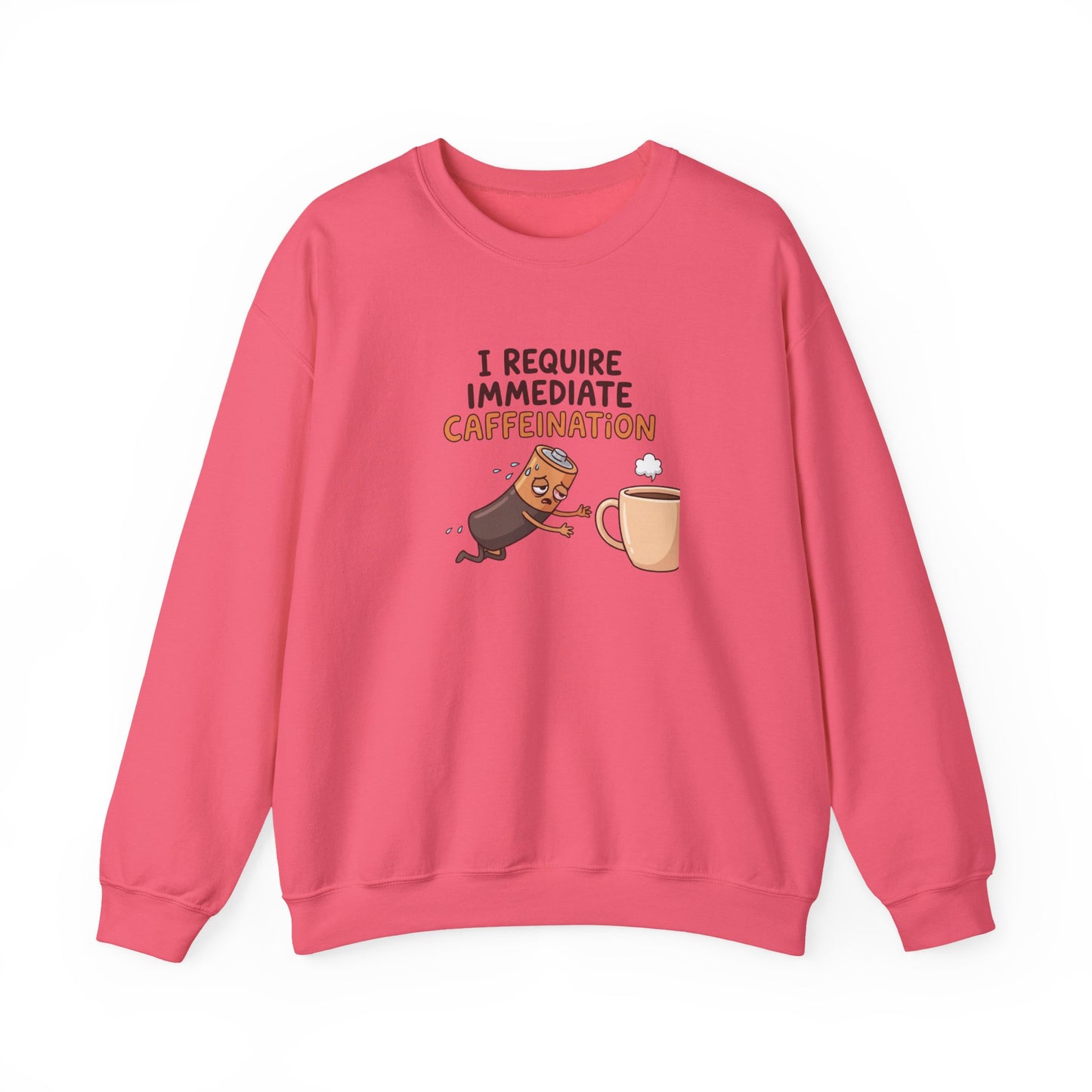 Pink sweatshirt with cartoon text "I require immediate caffeination" and a tired battery reaching for coffee.
