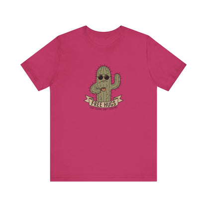 Pink t-shirt with a cartoon cactus wearing sunglasses offering "FREE HUGS" with a "JUST KIDDING, DON'T TOUCH ME!" sign.