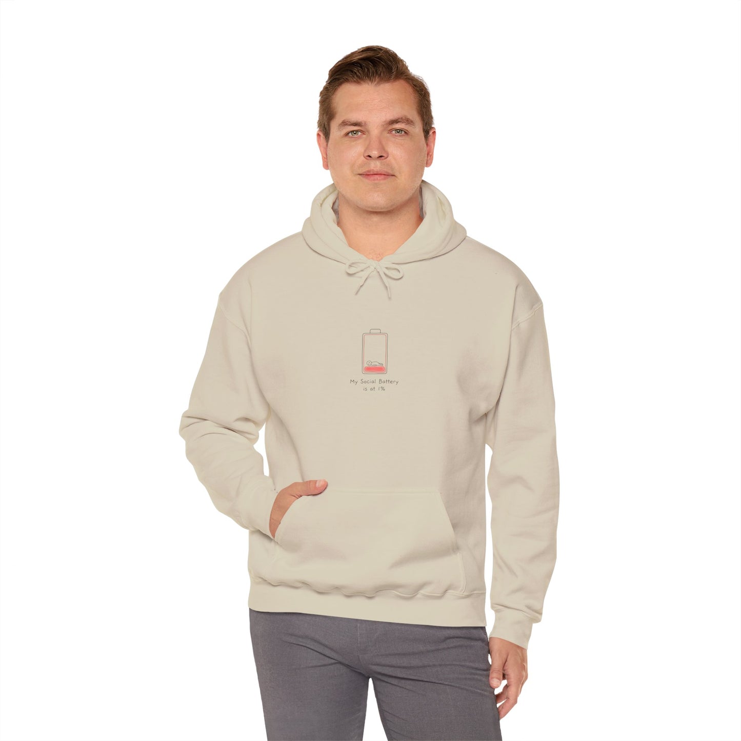 Cream hoodie with "My Social Battery is at 1%" graphic and a man's hand in pocket.