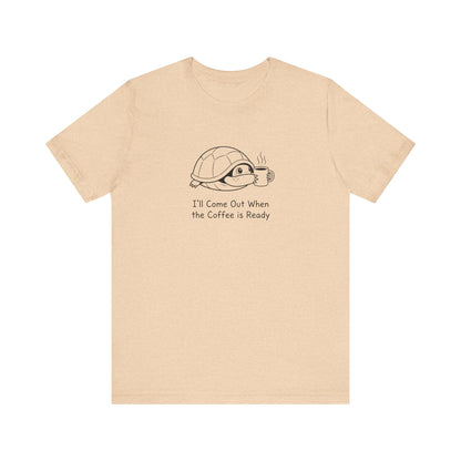 Cream t-shirt with a cartoon turtle waiting for coffee.