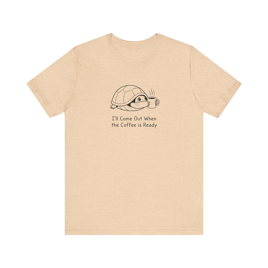 Cream t-shirt with a cartoon turtle waiting for coffee.