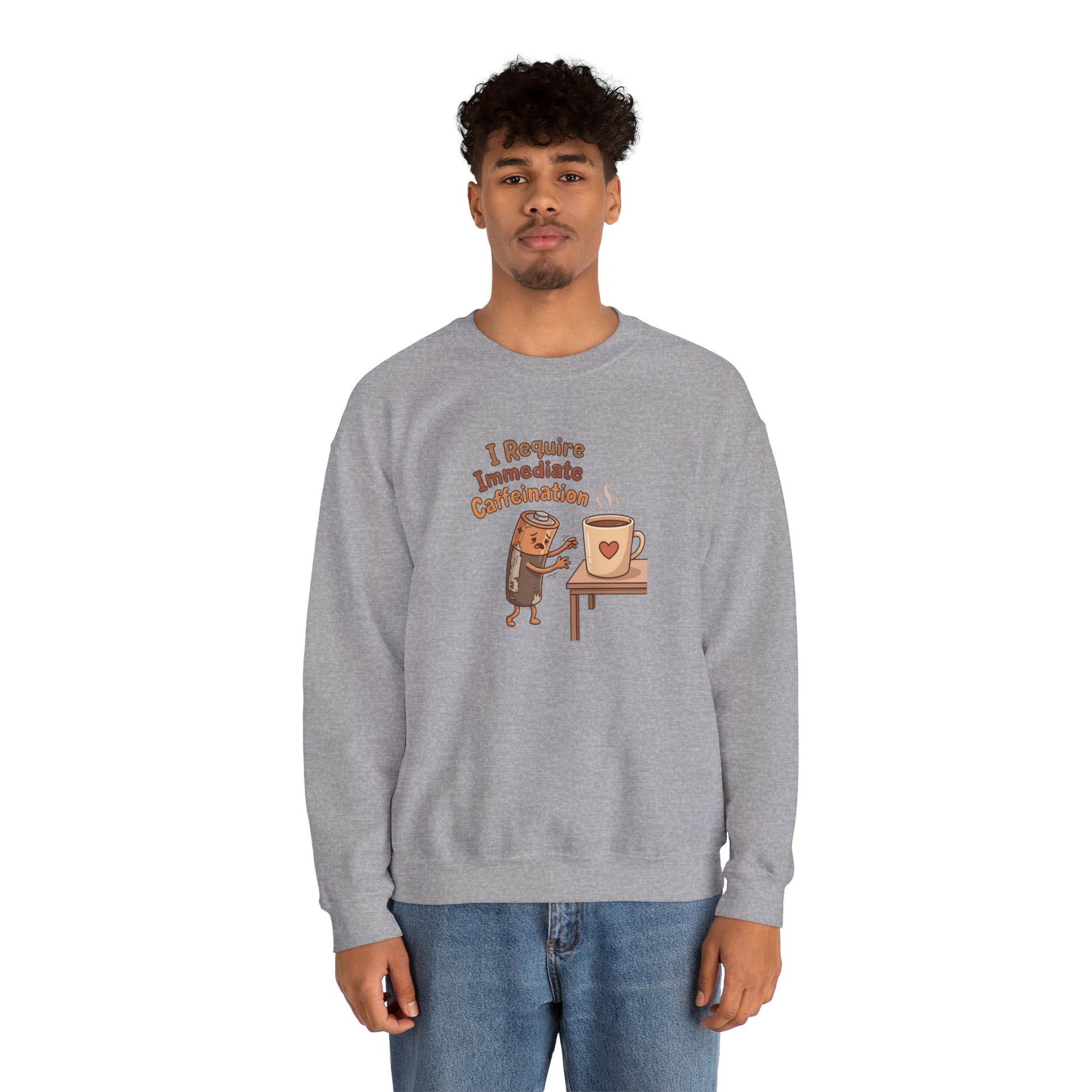Cartoon coffee cup with text "I Require Immediate Caffeination" on a grey sweatshirt.