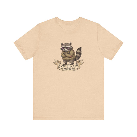 T-shirt with raccoon wearing sweater, text "I came, I saw, I had social anxiety and left".