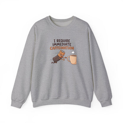 Grey sweatshirt with cartoon battery reaching for coffee cup with "I REQUIRE IMMEDIATE CAFFEINATION".