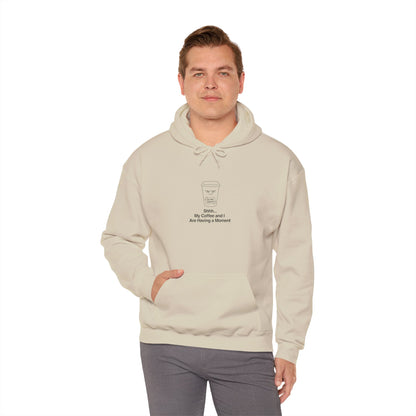 Cream hoodie with a minimalist coffee cup graphic and text.