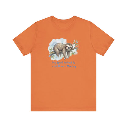 Orange t-shirt with a watercolor sloth hanging from a branch, text reads "My Spirit Animal is a Sloth on a Monday."
