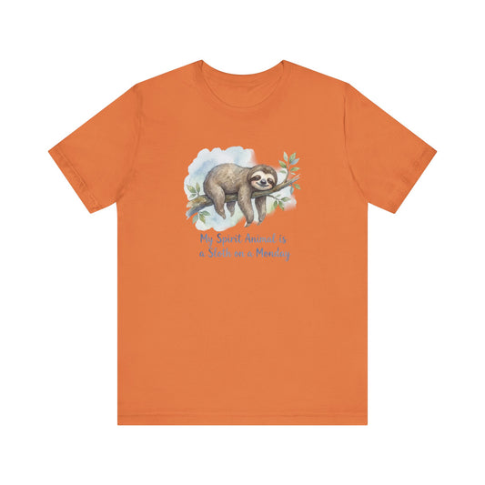 Orange t-shirt with a watercolor sloth hanging from a branch, text reads "My Spirit Animal is a Sloth on a Monday."