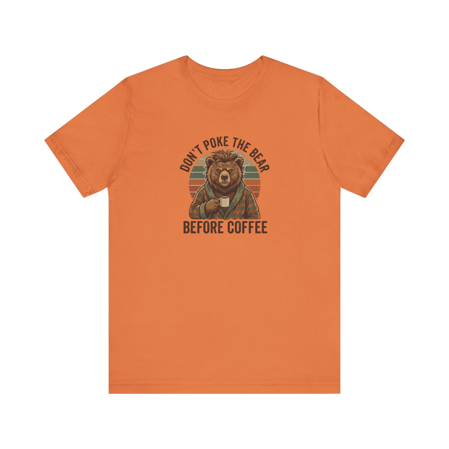Orange t-shirt with cartoon bear in robe holding coffee, "Don't poke the bear before coffee" text.
